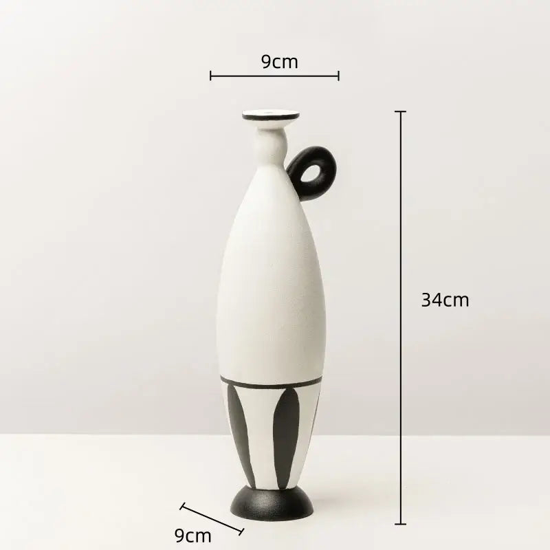 White ceramic vase with black handle and geometric black lines leaf-patterned base for living room decor