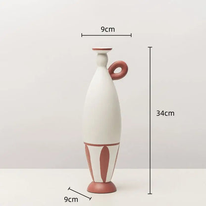 A tall slender white ceramic vase with terracotta geometric black lines and a matching handle for living room decor