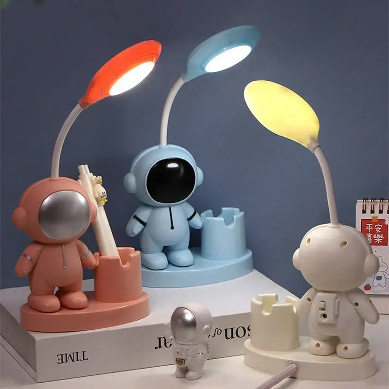 White astronaut desk lamp with pencil sharpener and colorful illuminated spoon-shaped shades for study decorbites astronaut study