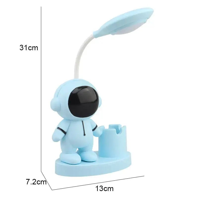 Light blue astronaut-themed desk lamp with flexible neck and black visor featuring pencil sharpener by decorbites astronaut study