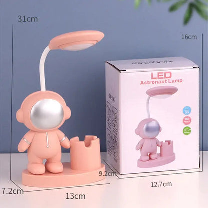 Pink astronaut-shaped led desk lamp with silver visor and flexible neck for decorbites astronaut study with pencil sharpener