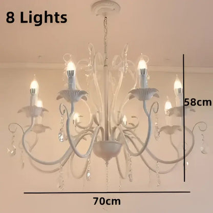 White and black metal chandelier with crystal pendants featuring eight candle-style lights for dining room decorbites black white