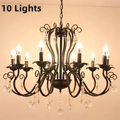 Black white metal chandelier with ten lit candle bulbs and crystal pendants for elegant dining room decorbites design