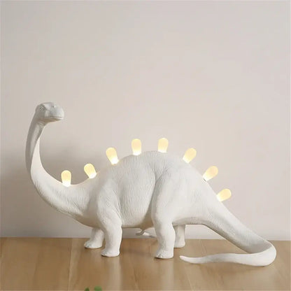 White brontosaurus t-rex dinosaur resin led desk lamp with glowing yellow lights for bedroom lighting