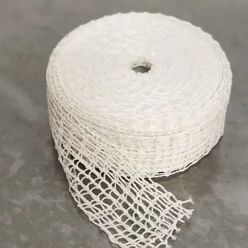 White woven mesh butcher’s string roll coiled with central hole for kitchen display and meat netting use