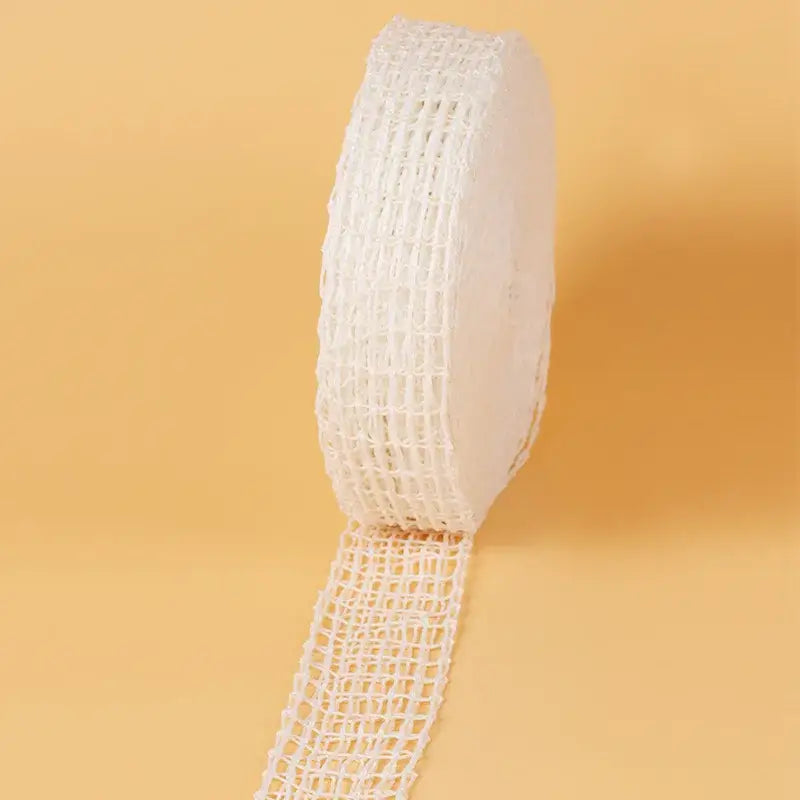 White butcher’s string roll made of mesh netting with a consistent grid pattern for kitchen display use
