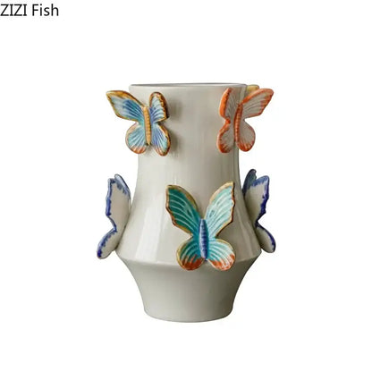 White butterfly ceramic vase by decorbites featuring colorful 3D blue, orange, and teal butterflies for living room decor