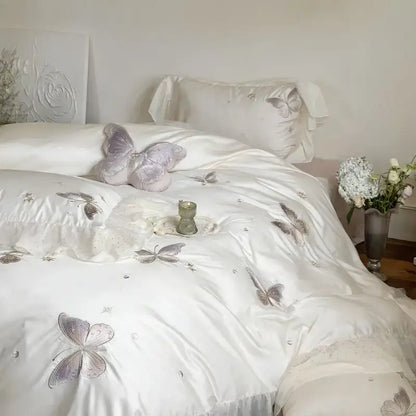 White satin bedding set with silver butterfly lace ruffles embroidery and subtle shimmering accents by decorbites butterfly lace