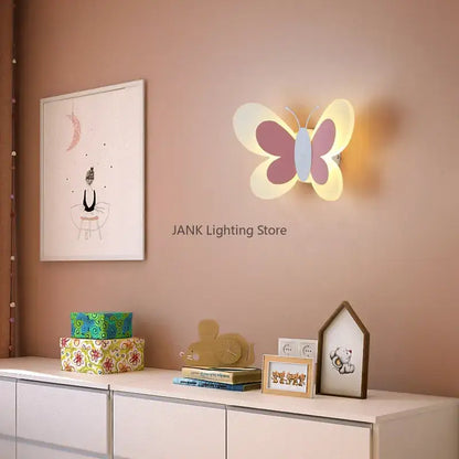 White butterfly led wall lamp with soft illuminated pastel pink and light blue layered wings for bedroom decorbites butterfly led wall