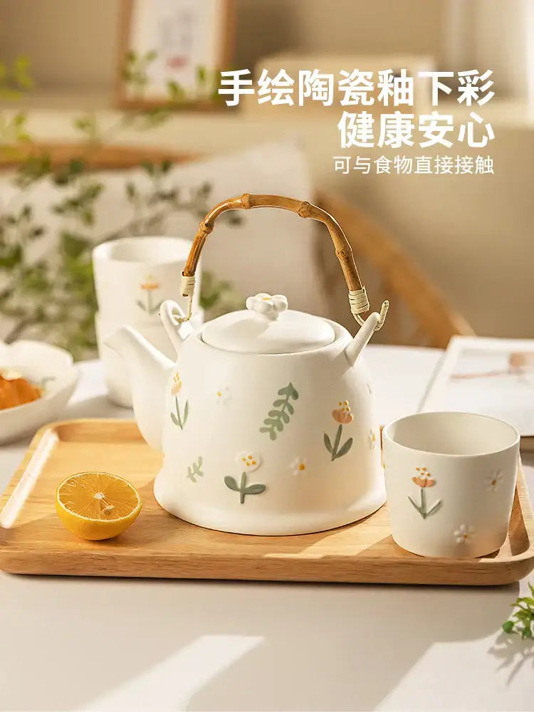 White ceramic daisy teapot set with hand-painted floral design and bamboo handle for kitchen tea use