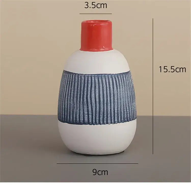 White ceramic vase with blue ribbed middle and red neck featuring colorful graffiti lines for living room decor