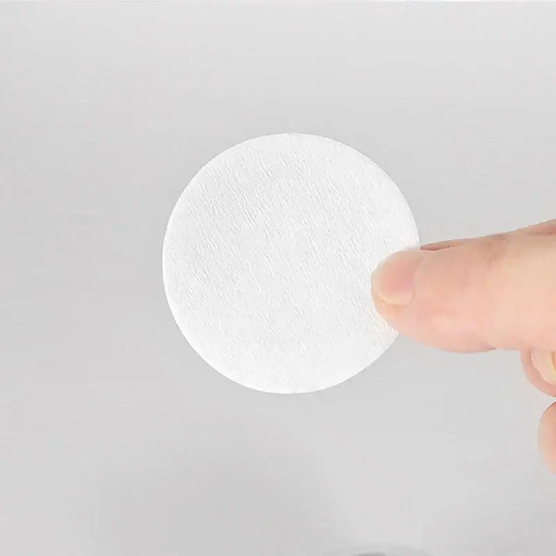 White circular disposable coffee filter papers with a textured paper-like surface for espresso by decorbites filter papers