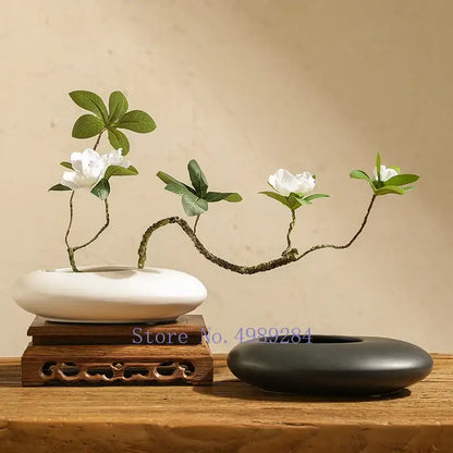 White cobblestone deformation ceramic vase with bonsai-style floral arrangement for elegant living room decor