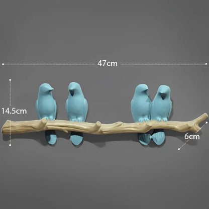 Blue resin decorbites bird resin hanger perched on natural wood branch wall decor for kitchen or home use
