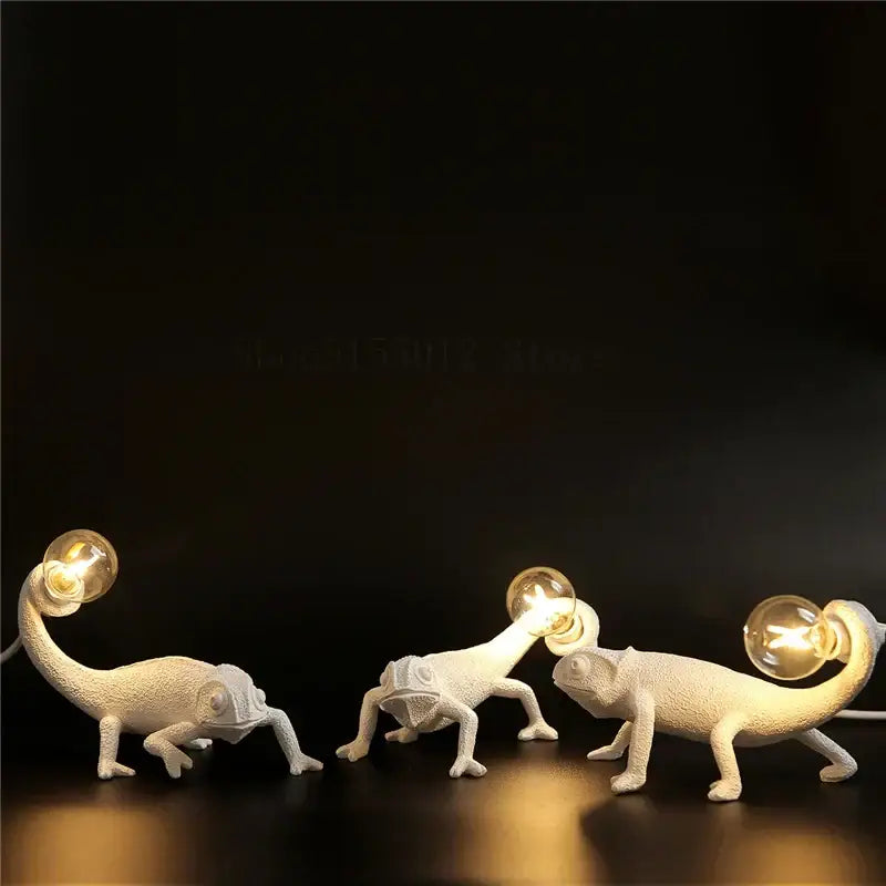 Three white decorbites chameleon figure resin wall lamps with glowing bulbs for bedroom night light use