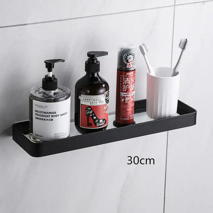 Black metal corner shelf with sleek modern design and 30cm length paired with white double tier glass corner shelf with towel bar