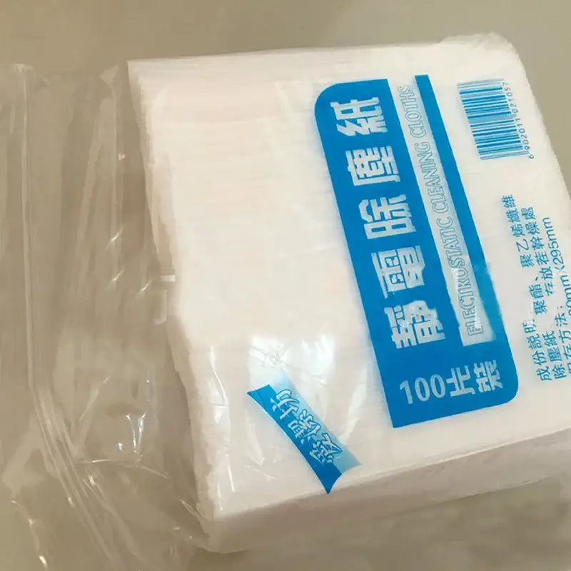 A package of white electrostatic kitchen cleaning cloths by decorbites with 100 pieces sealed in clear plastic
