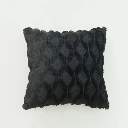 Black textured throw pillow with diamond-patterned weave and frayed edges as a stylish diamond cushion cover