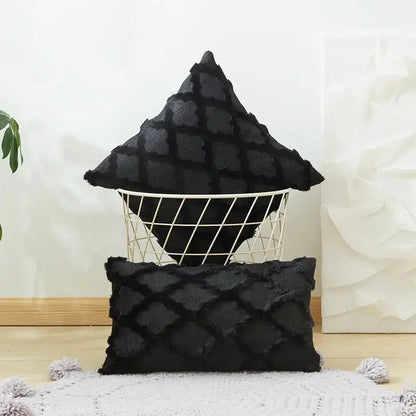 Black textured throw pillows with embroidered diamond cushion cover and frayed edges for living room decor