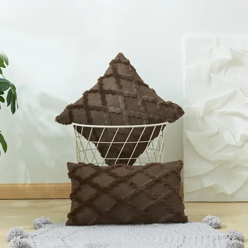 Brown textured throw pillows with diamond pattern and frayed edges as embroidered diamond cushion cover in wire basket