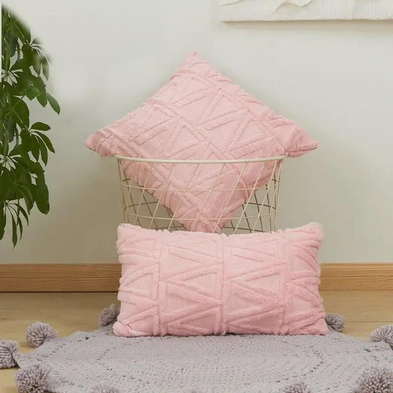 Soft pink cushion covers with geometric embroidered diamond patterns in square and rectangular shapes for decor