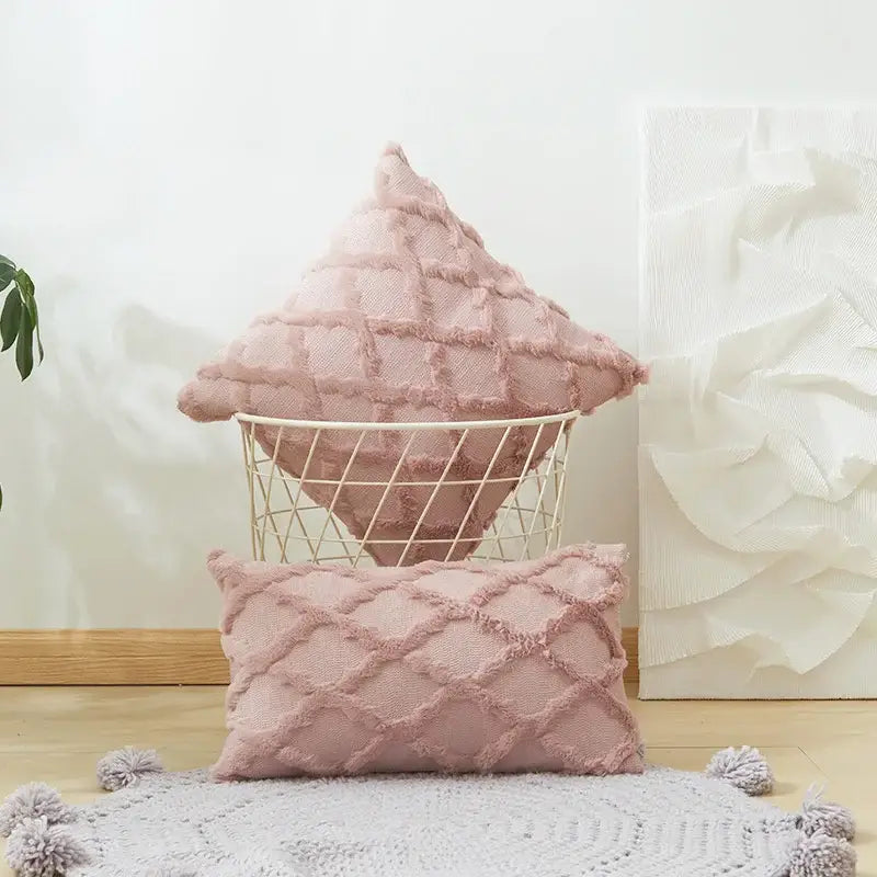 Soft pink embroidered diamond cushion cover with textured diamond pattern and fringed edges for living room decor