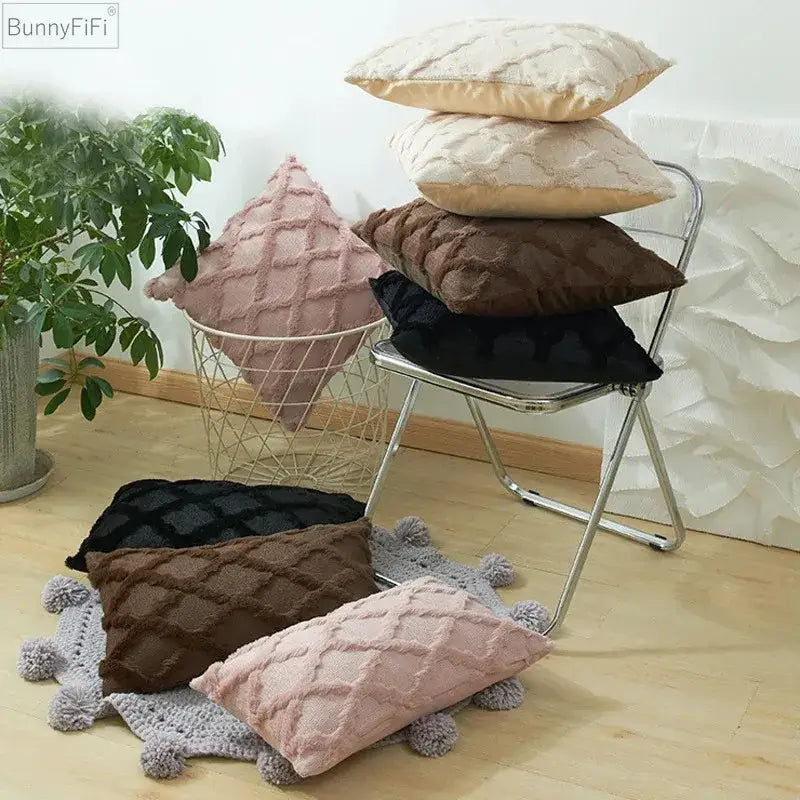 Stack of plush embroidered diamond cushion covers in soft pink beige brown and black for living room decor