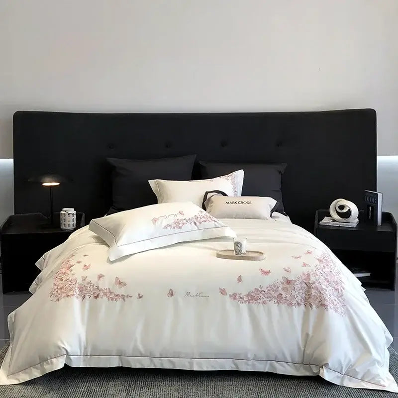 White mark cross bed set with delicate pink butterfly embroidery and subtle piping details in egyptian cotton bedding sets