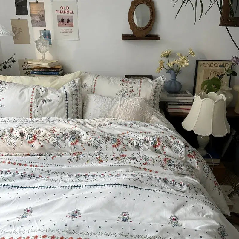 White floral embroidered cotton duvet cover set featuring delicate embroidery and subtle color accents for bedroom use