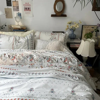 White floral embroidered cotton duvet cover set featuring delicate embroidery and subtle color accents for bedroom use