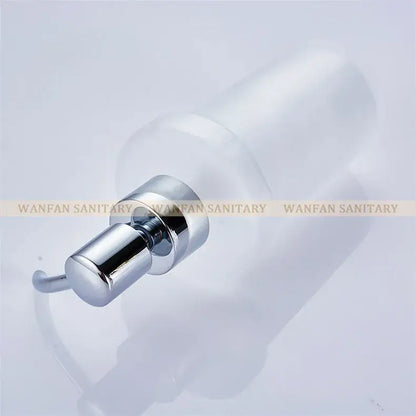 White frosted glass liquid soap dispenser with a gold pump and chrome finish for modern bathroom use