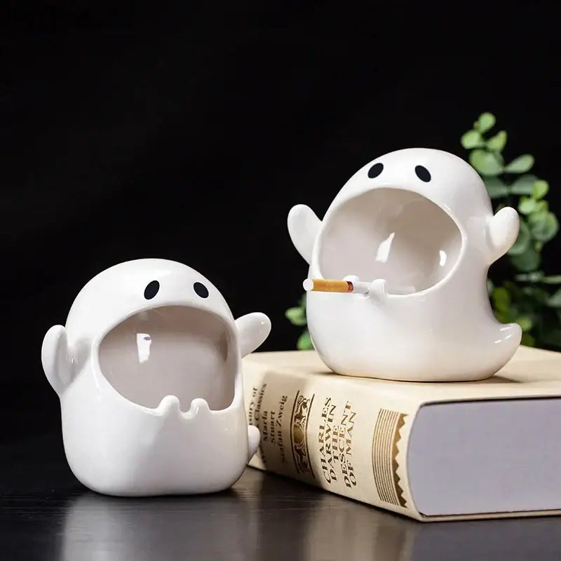 White ghost genie halloween porcelain ashtray with black eyes holding a cigarette for desk decor or office use