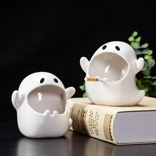 White ghost genie halloween porcelain ashtray with black eyes holding a cigarette for desk decor or office use