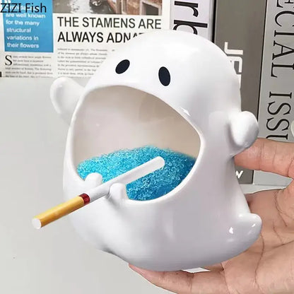 White ghost genie halloween porcelain ashtray with black eyes and blue glittery ashes for desk decor office use