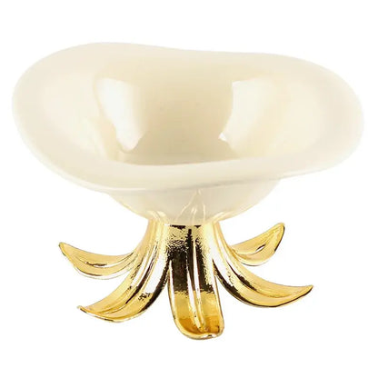 Cream-colored ceramic fruit plate with a glossy finish on an ornate gold-toned metal petal base tray bowl centerpiece