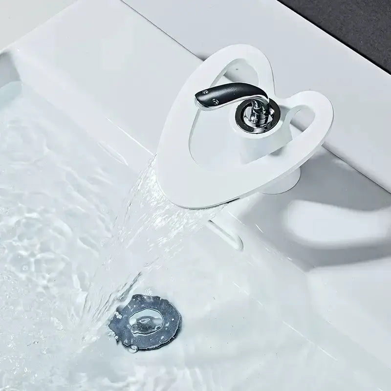 White ceramic basin faucet with sleek modern design and black handle from decorbites golden white collection
