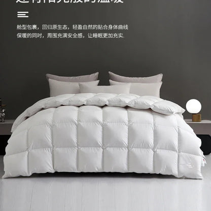 White quilted down comforter with plush texture and square stitching for thick warm autumn winter use