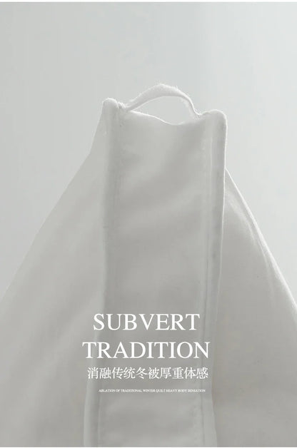 White goose down thick warm quilted winter blanket with plush texture and subtle sheen for autumn and winter use