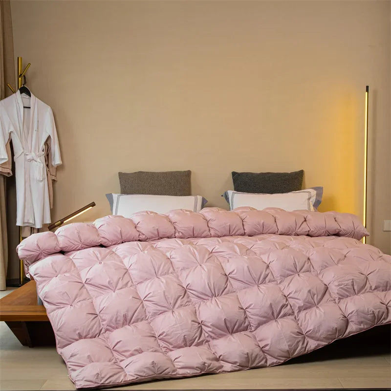A plush light pink velvet quilt with diamond quilting filled with white goose down for autumn winter warmth