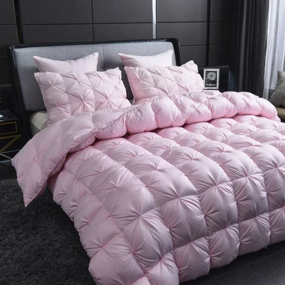 Pink quilted white goose down comforter with diamond stitching offers warm winter double duvet luxury and plush texture