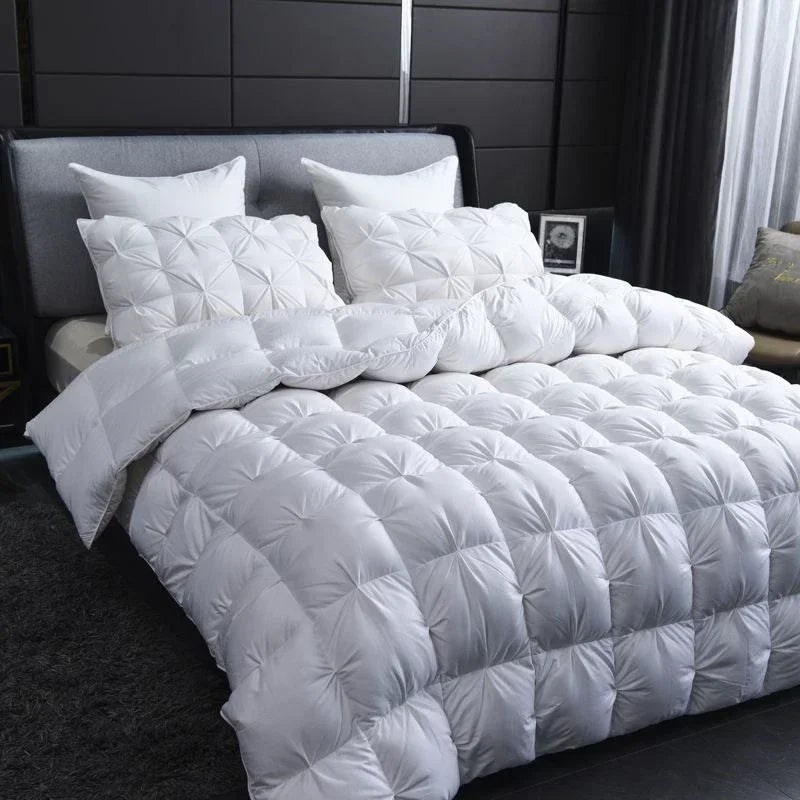 White quilted goose down comforter with plush texture and diamond stitching for warm winter double duvet use