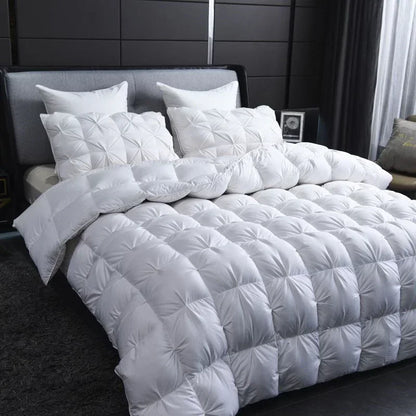 White quilted goose down comforter with plush texture and diamond stitching for warm winter double duvet use