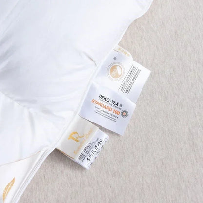 White goose down double duvet with warm winter thick plush texture and subtle gold embroidery edge detailing