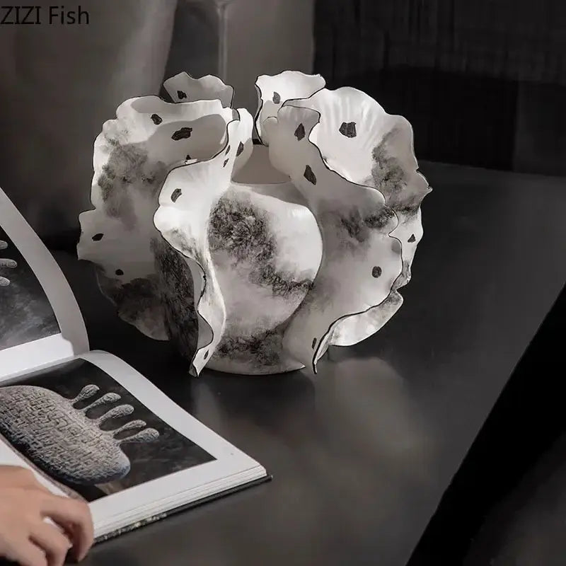 White and gray ruffled ceramic vase with black speckled patterns and artificial flowers for decorbites colorful wings decor