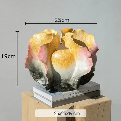 White and gray ruffled ceramic vase with artificial flowers featuring a colorful wings resin floral centerpiece decorbites colorful wings