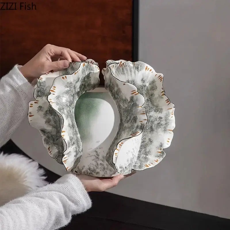 White and gray ruffled ceramic vase with artificial flowers featuring a soft green gradient for decorbites colorful wings decor