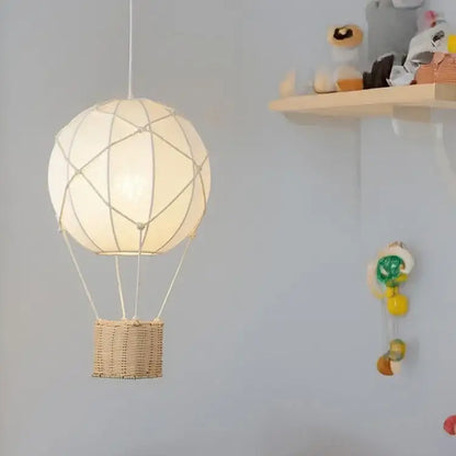 White hot air balloon chandelier with cream wicker basket and rope detailing for kids room decorbites hot air balloon