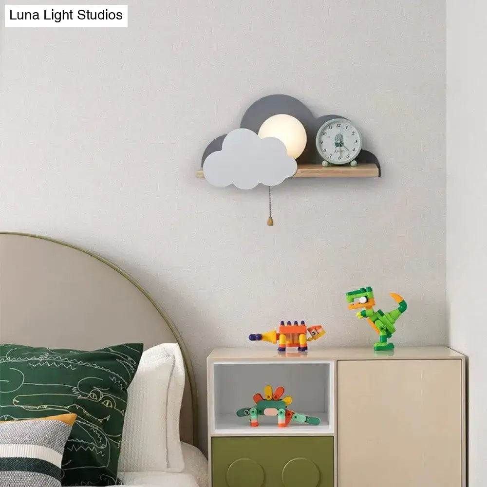 White macaron led cloud wall lamp with soft white globe and layered gray cutouts on minimalist wooden shelf for children’s room