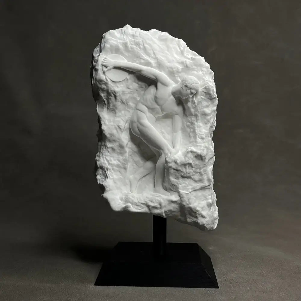 White marble discus throwing nude sculpture in dynamic pose on black pedestal ideal for elegant home decor