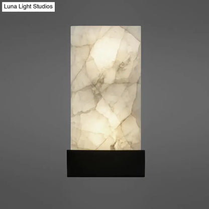 A sleek rectangular onyx wall sconce with glowing white interior and dark base for e26 e27 living room lighting